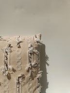 Textured Beige Boho Cushion with Tassel Accents