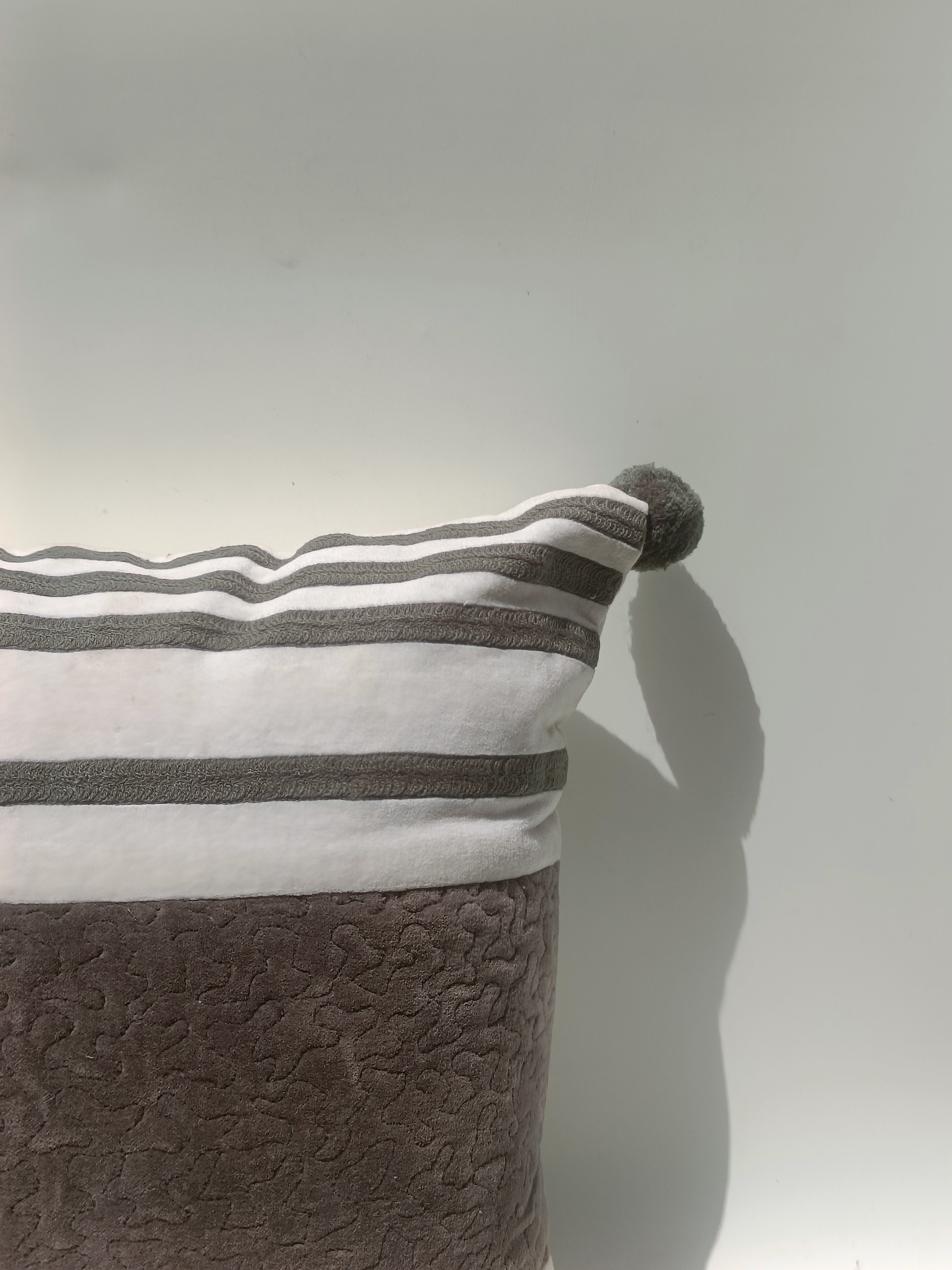 Elegant Velvet Striped Cushion with Pom-Pom Corners