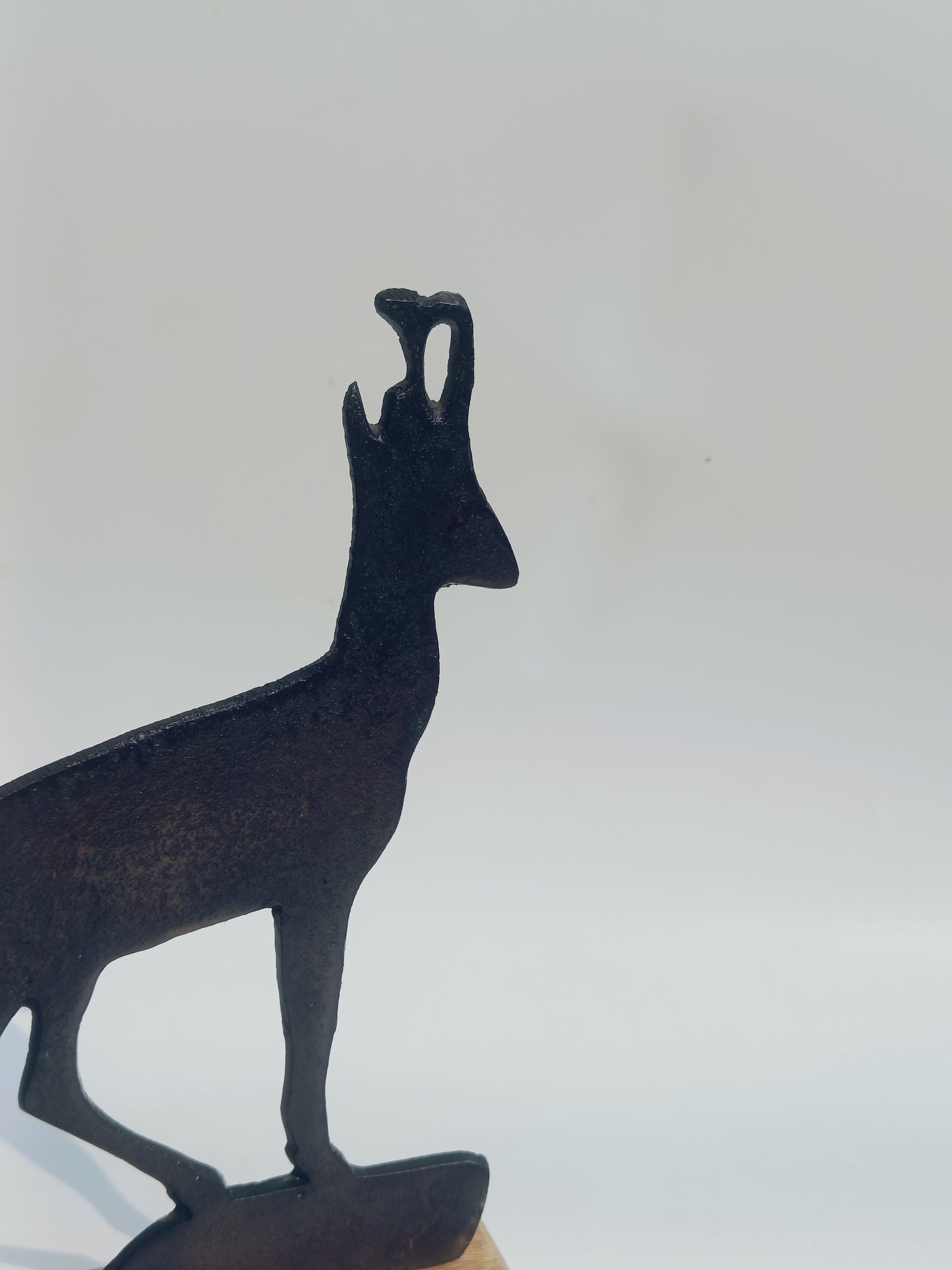 Iron Deer Silhouette on Wooden Base
