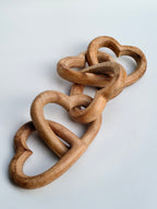 Hand-Carved Interlocking Wooden Hearts Sculpture