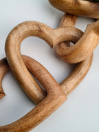 Hand-Carved Interlocking Wooden Hearts Sculpture