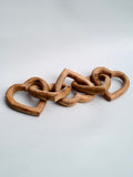 Hand-Carved Interlocking Wooden Hearts Sculpture
