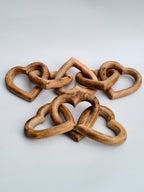 Hand-Carved Interlocking Wooden Hearts Sculpture