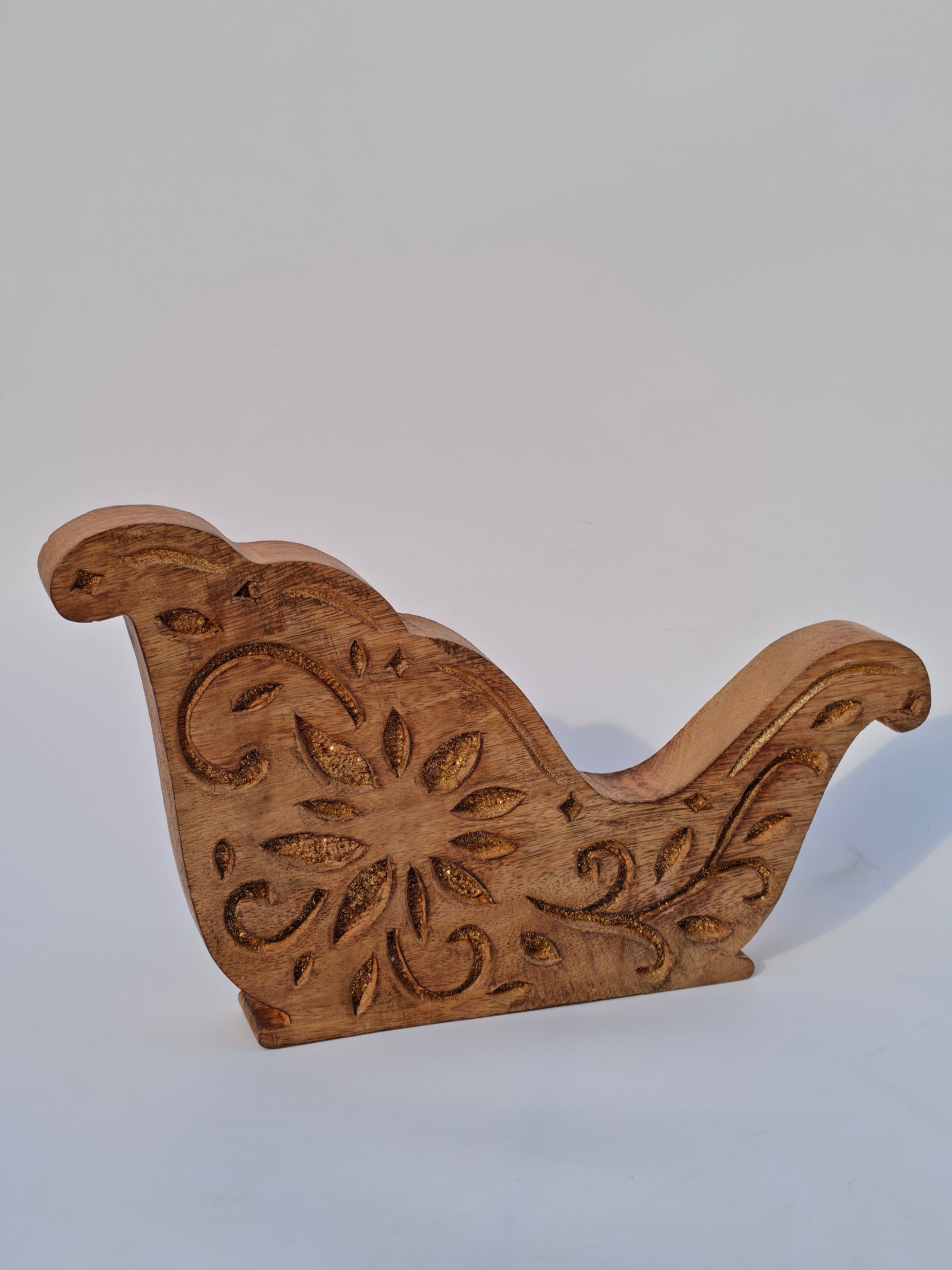 Handcrafted Wooden Sleigh Cutout with Floral Carvings – Rustic Christmas Décor