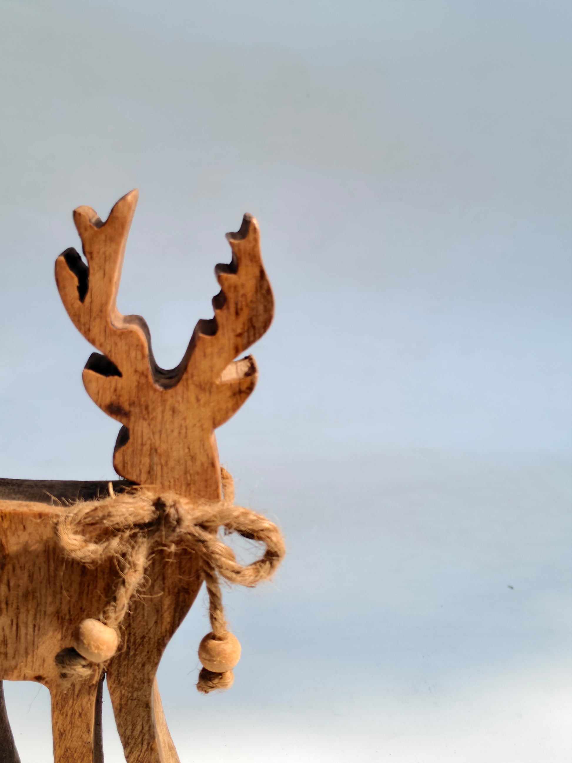 Handcrafted Wooden Reindeer Figurine with Rustic Jute Bow