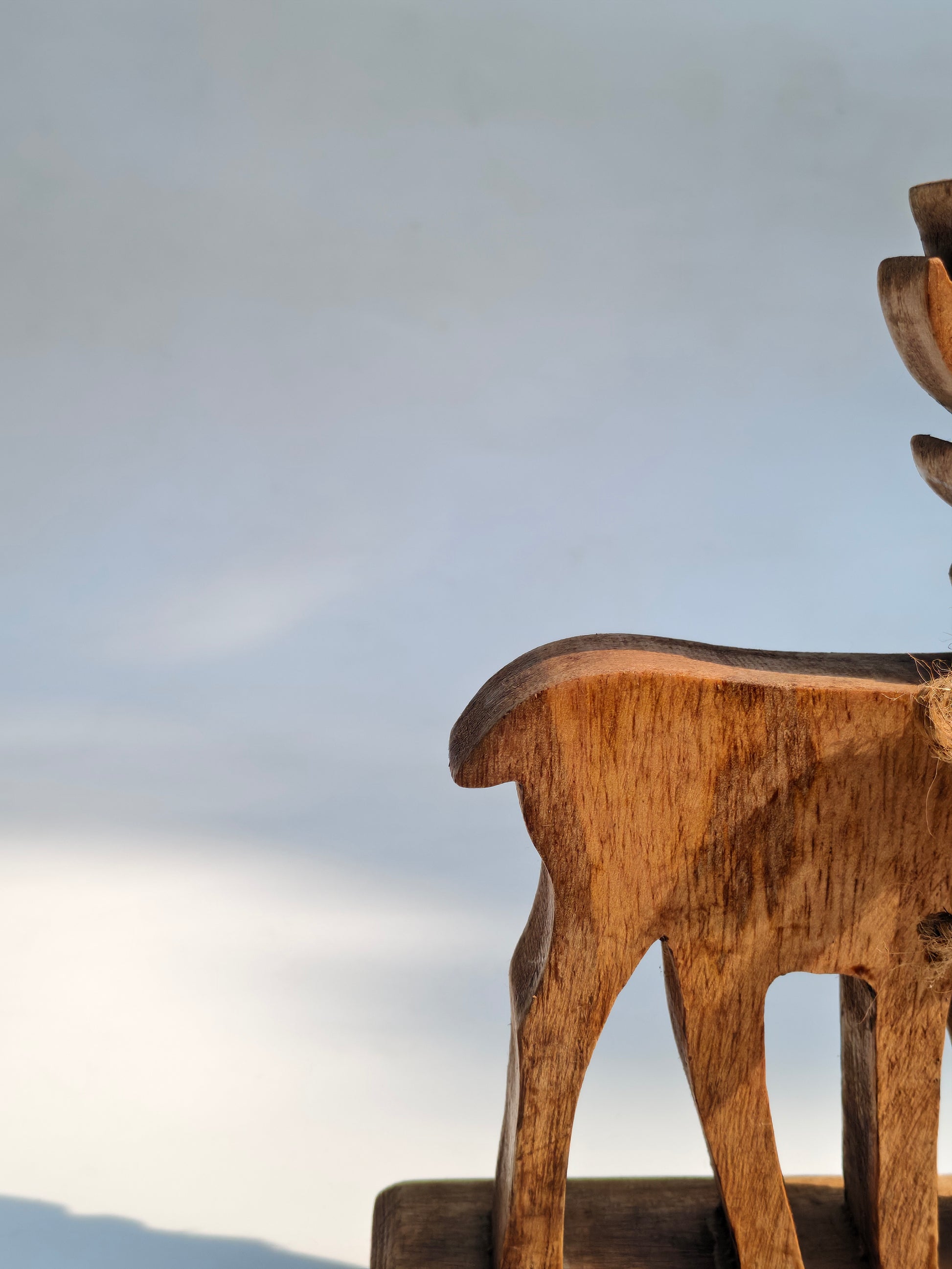 Handcrafted Wooden Reindeer Figurine with Rustic Jute Bow