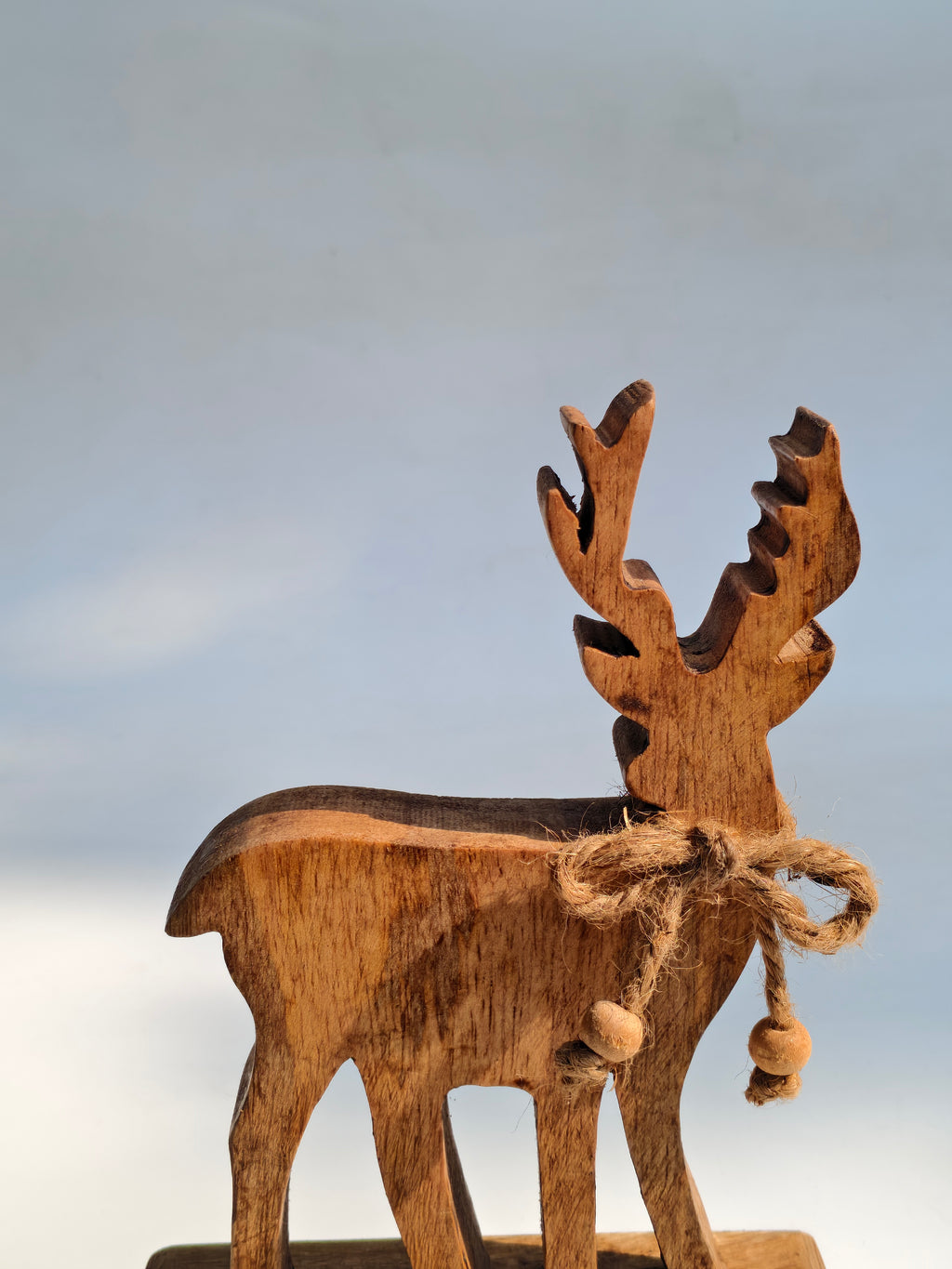 Handcrafted Wooden Reindeer Figurine with Rustic Jute Bow