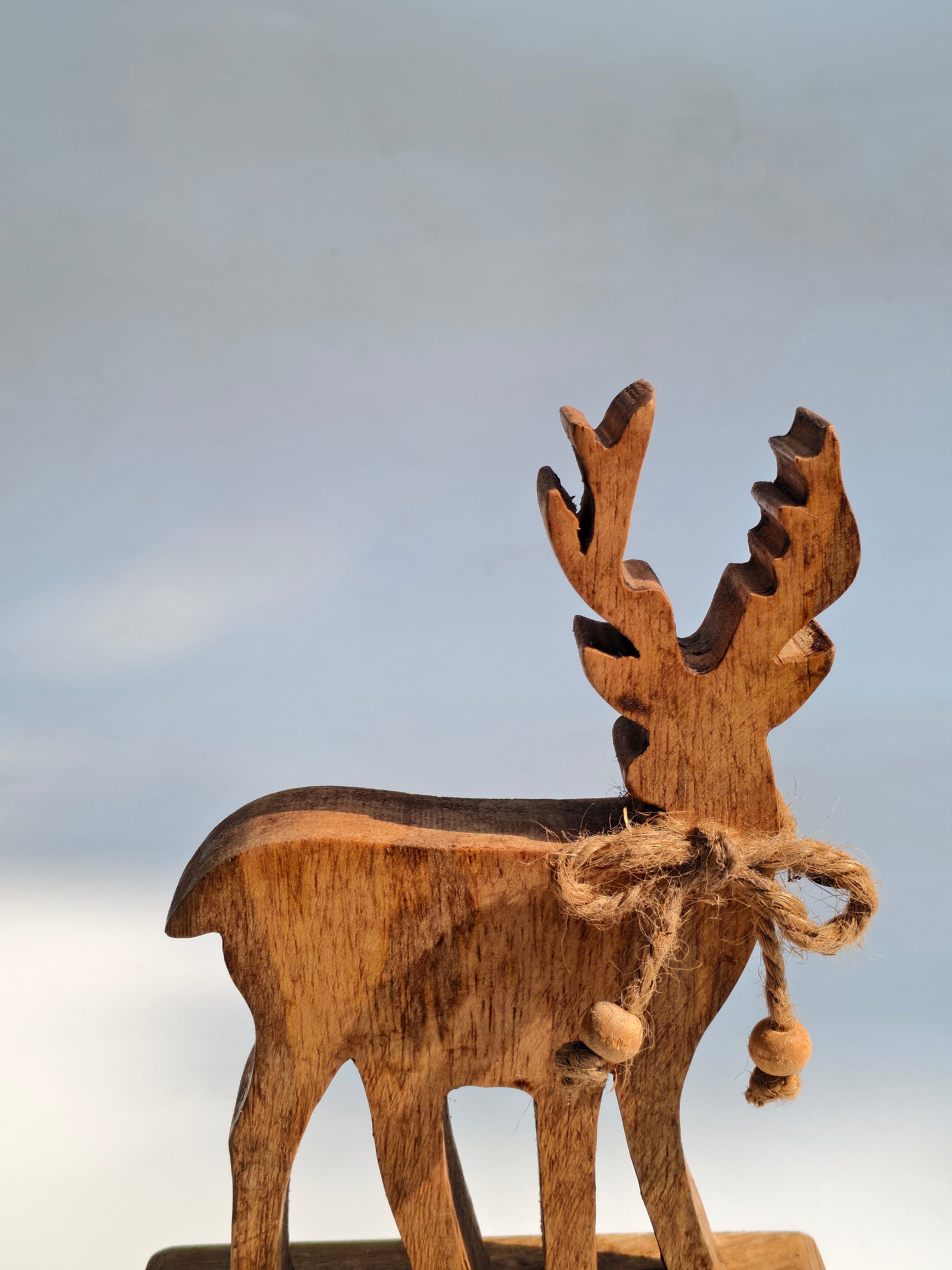 Handcrafted Wooden Reindeer Figurine with Rustic Jute Bow