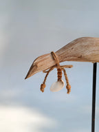 Handcrafted Wooden Bird Sculpture with Shell Accent