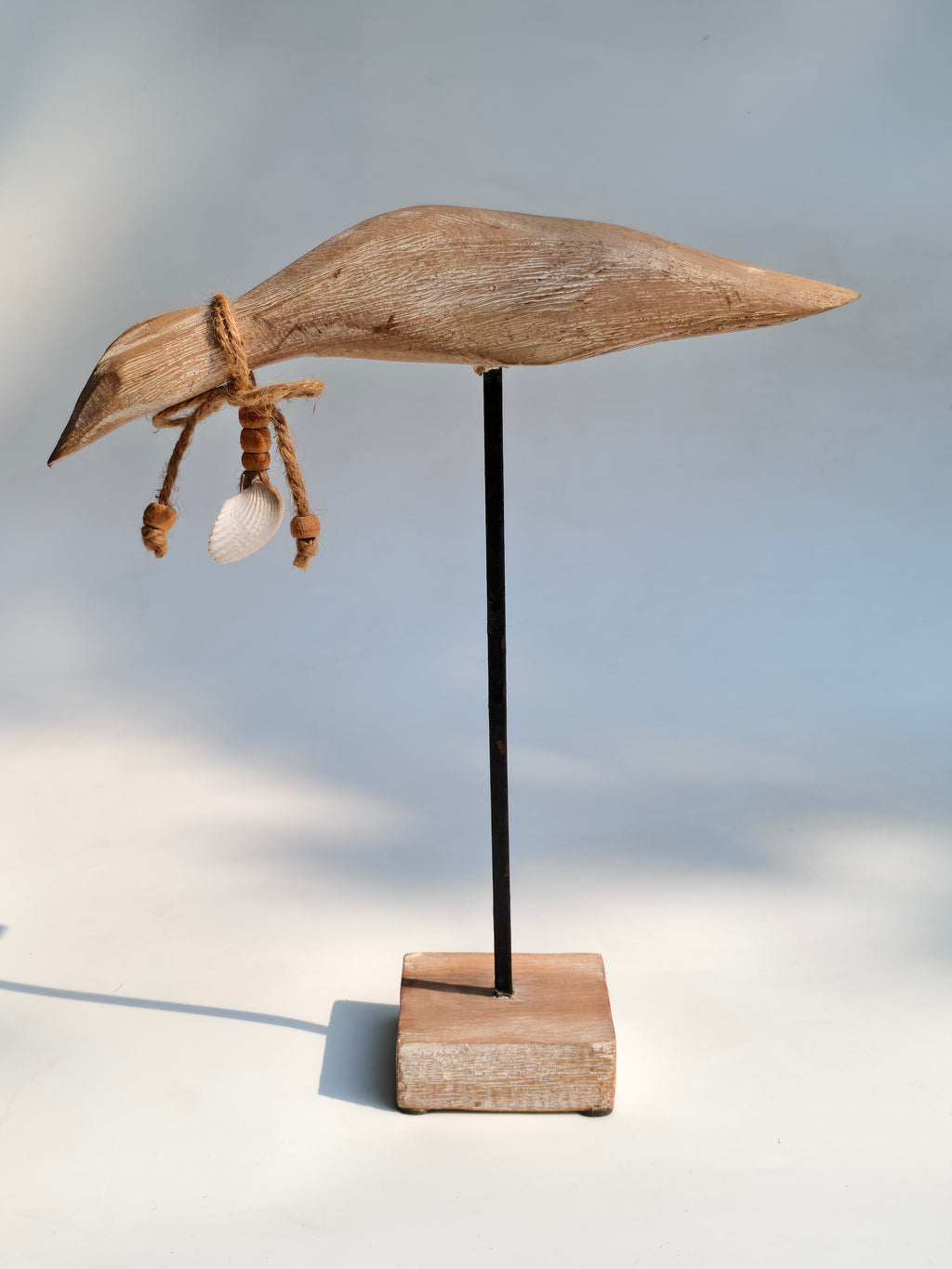 Handcrafted Wooden Bird Sculpture with Shell Accent