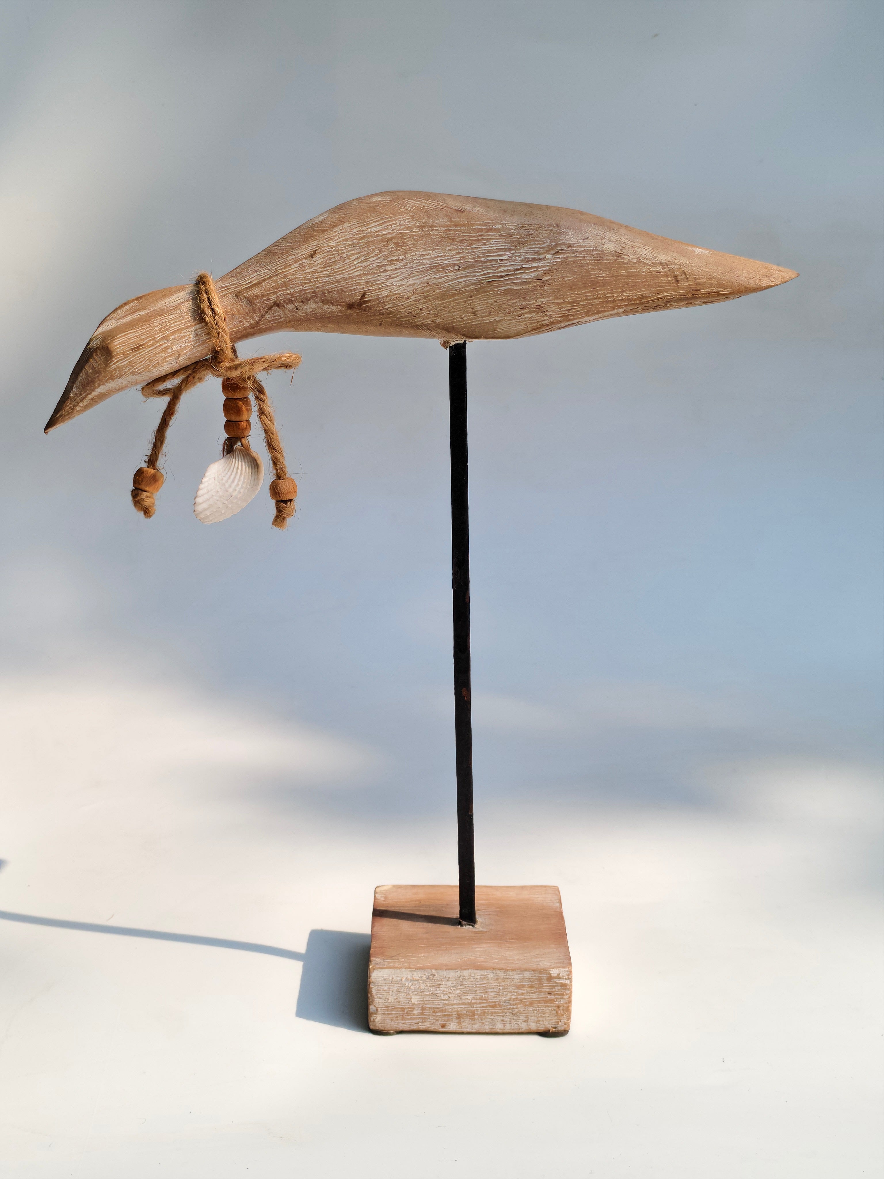 Handcrafted Wooden Bird Sculpture with Shell Accent